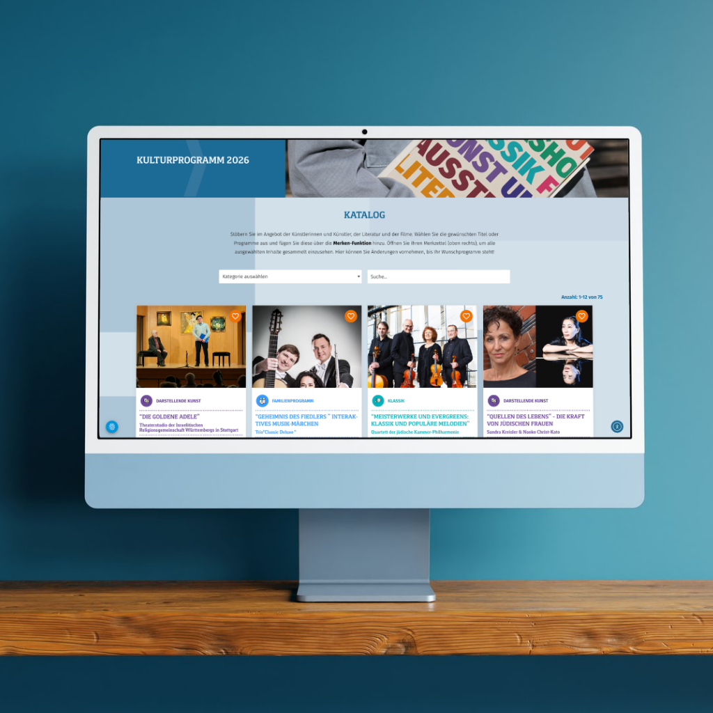 Computer zeigt Kulturprogramm-Katalog 2026 auf Bildschirm.
